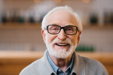 Smiling dental implant patient after tooth replacement