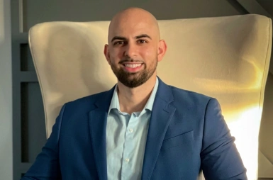 Dr. Jack Yacoub smiling in the office