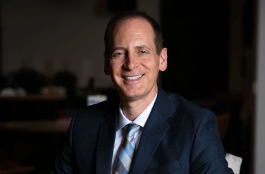 Dr. Jason A. Pellegrino smiling in the office