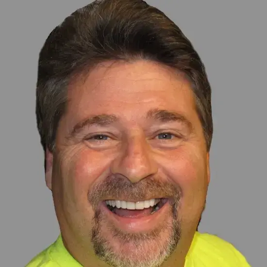 Smiling man displaying improved teeth after veneer treatment in Allentown.