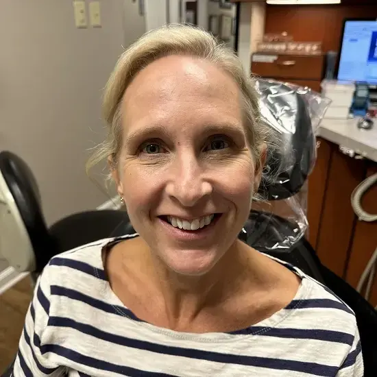 Smiling patient showing before results of dental veneers for misaligned teeth in Allentown.