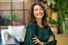 Woman smiling after cosmetic dentistry treatment